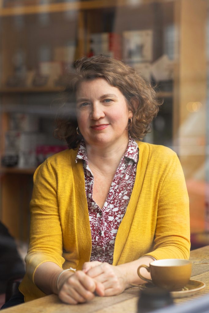 natural head shot of psychotherapist in cafe