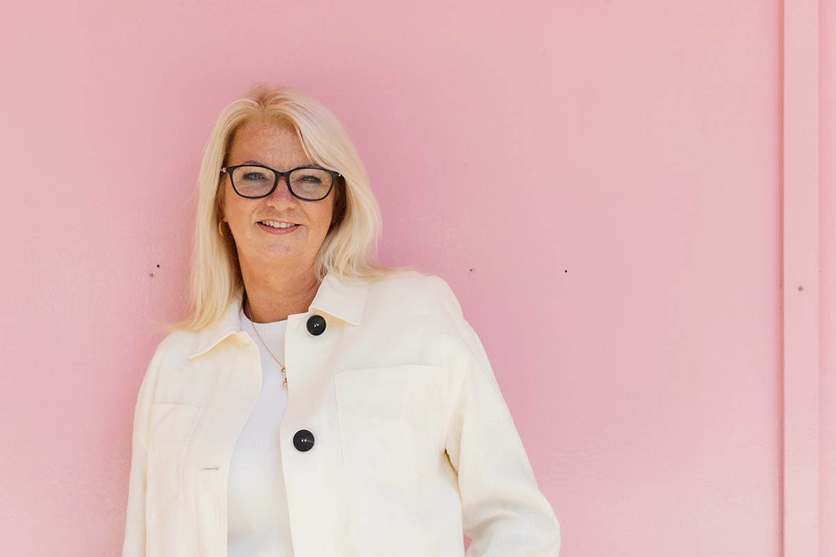 head shot against pink wall
