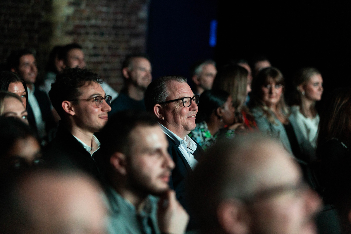 delegates at conference watching speaker in London. Event photography by Julie Kim.
